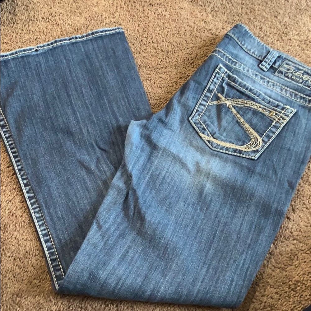 Light distressed Silver Jeans Lola Flare